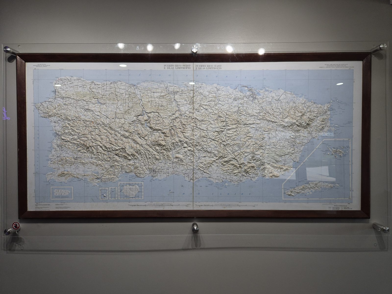 A framed relief map of Puerto Rico showing the central mountain range