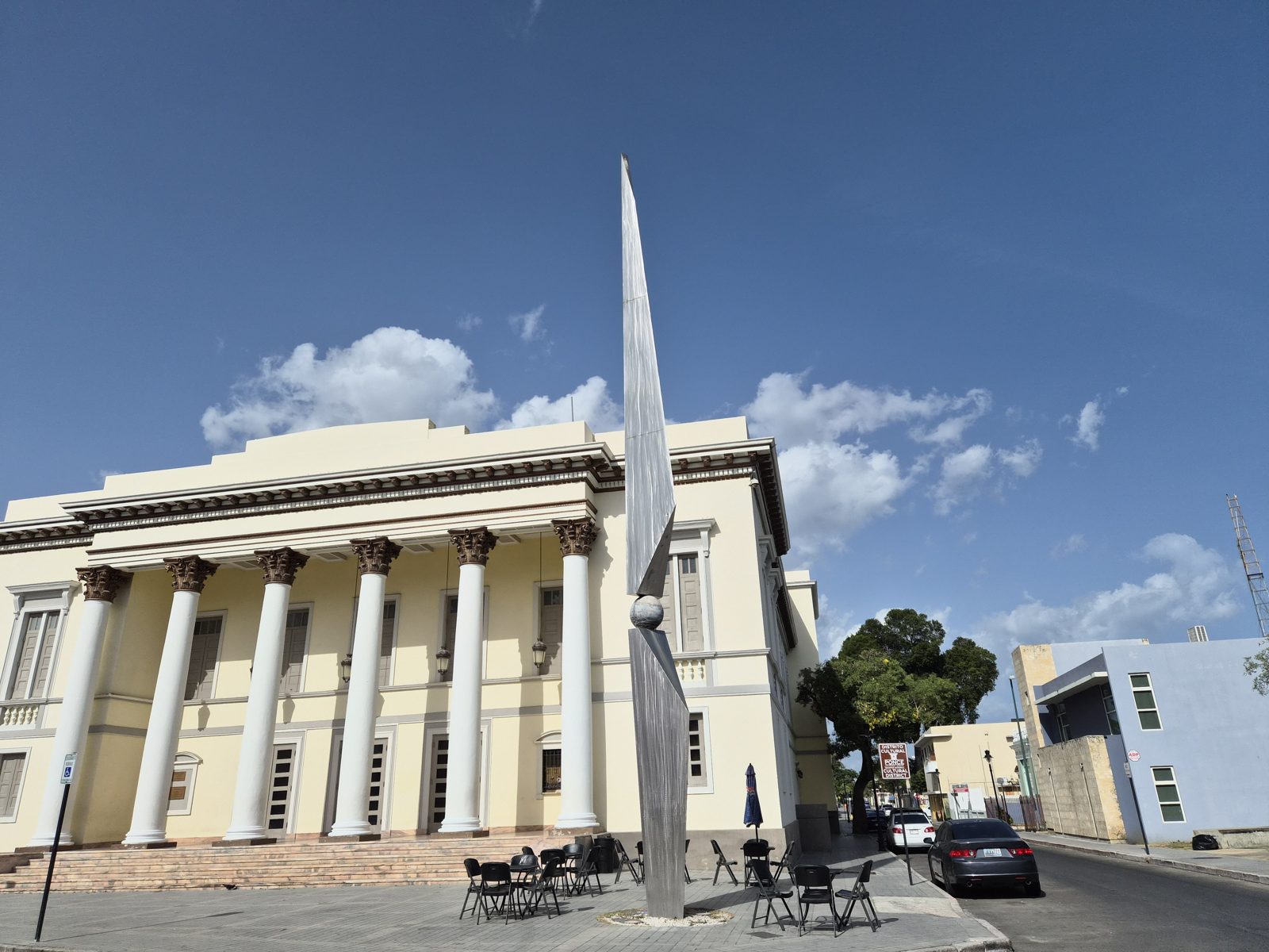 A neoclassical building in Ponce with tall white columns under a blue sky